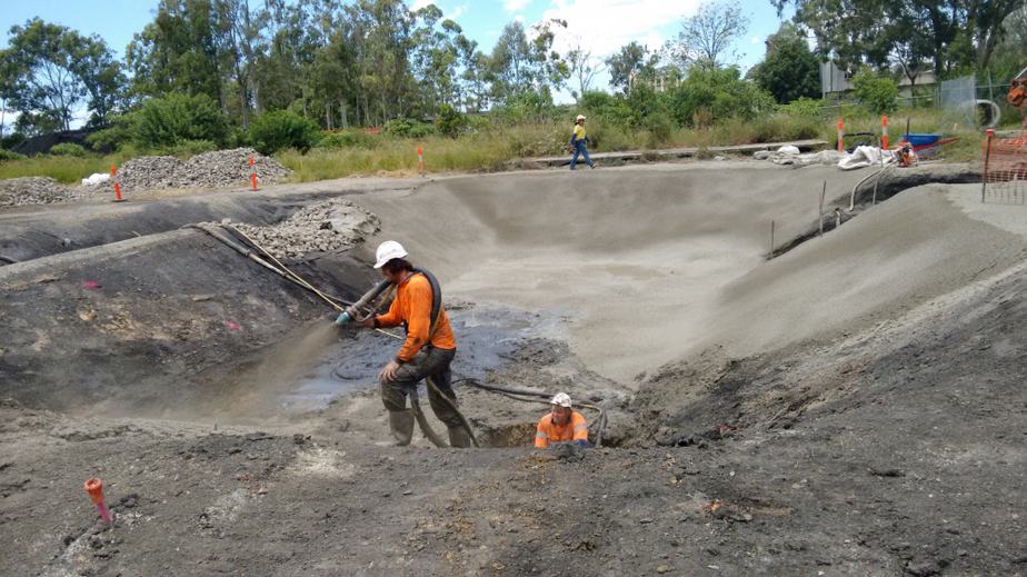 Big Ditch Dam Builder Spraying concrete dam as a part of dam sealing process