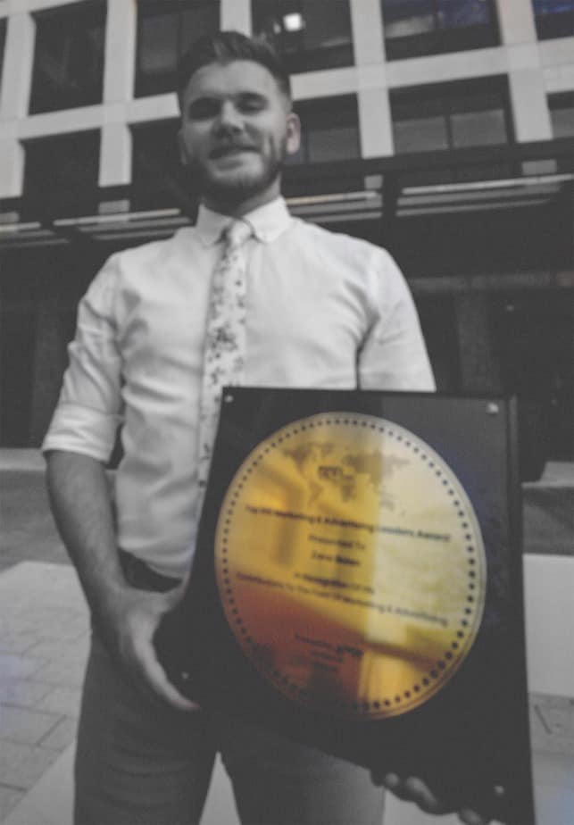 Big Ditch Dam Building Company man holding dam award copy