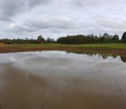 1. Dam construction site by Big Ditch Dam Building Company, pond and earthworks.