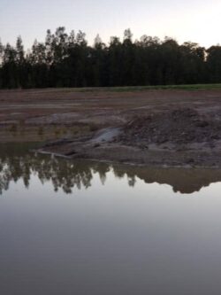 Excavation site at Big Ditch Dam Building Company in progress, preparing for dam construction.