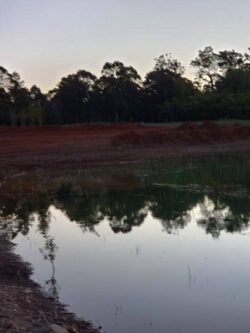 Heavy dam construction at Big Ditch Dam Building Company for water management and earthmoving solutions.
