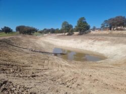 Dry reservoir dam construction by Big Ditch Dam Building Company with water management services.