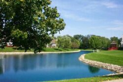 Lakeside dam construction by Big Ditch Dam Building Company, expert in pond and dam projects.