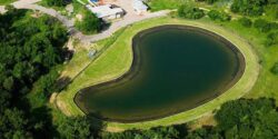 A heart-shaped pond built by Big Ditch Dam Building Company for water retention and landscape enhancement.
