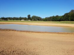 Crane dam construction for water management and dam building by Big Ditch Dam Building Company.